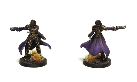 Photo of miniature with long coat and pistol, views from the front and the back