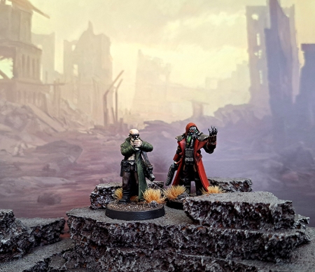 Two miniatures posed against a science fiction background.